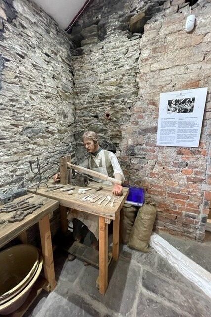 Room setting Owen Connors making pipes at Nantgarw China Works.